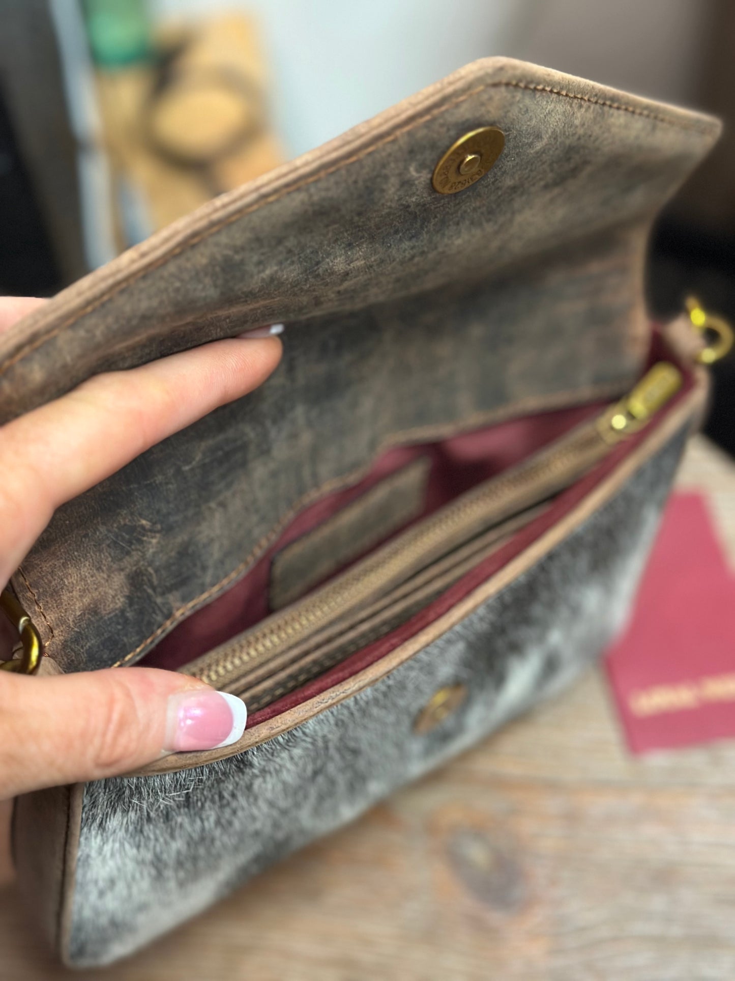 The LW speedster mini chain bag in brown and white cowhide