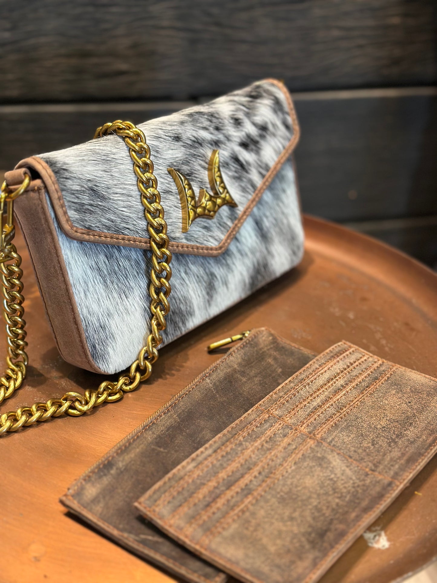 The LW speedster mini chain bag in brown and white cowhide