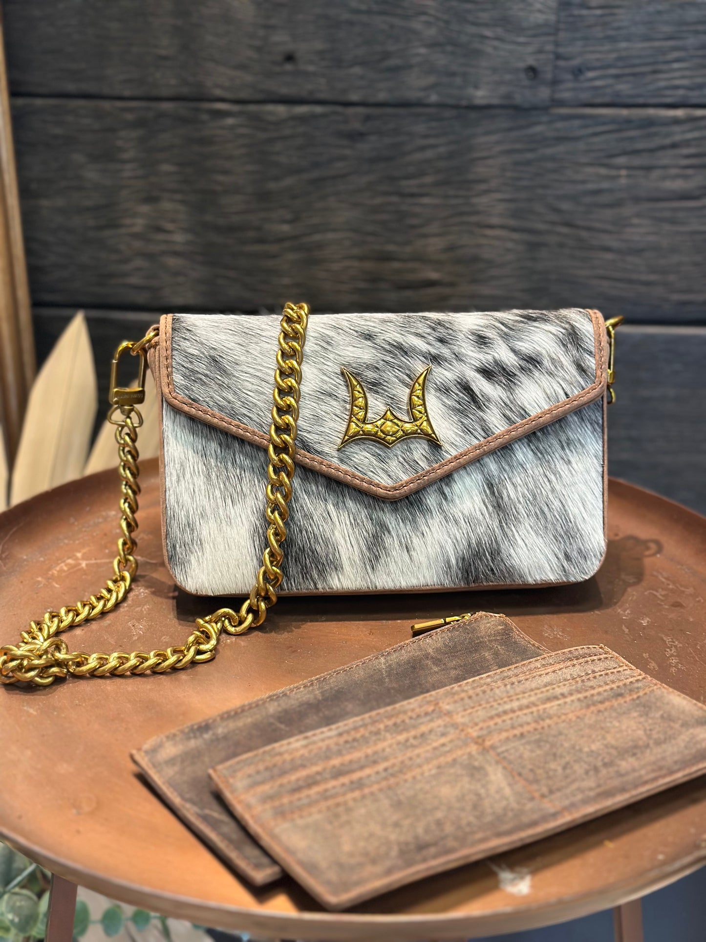 The LW speedster mini chain bag in brown and white cowhide