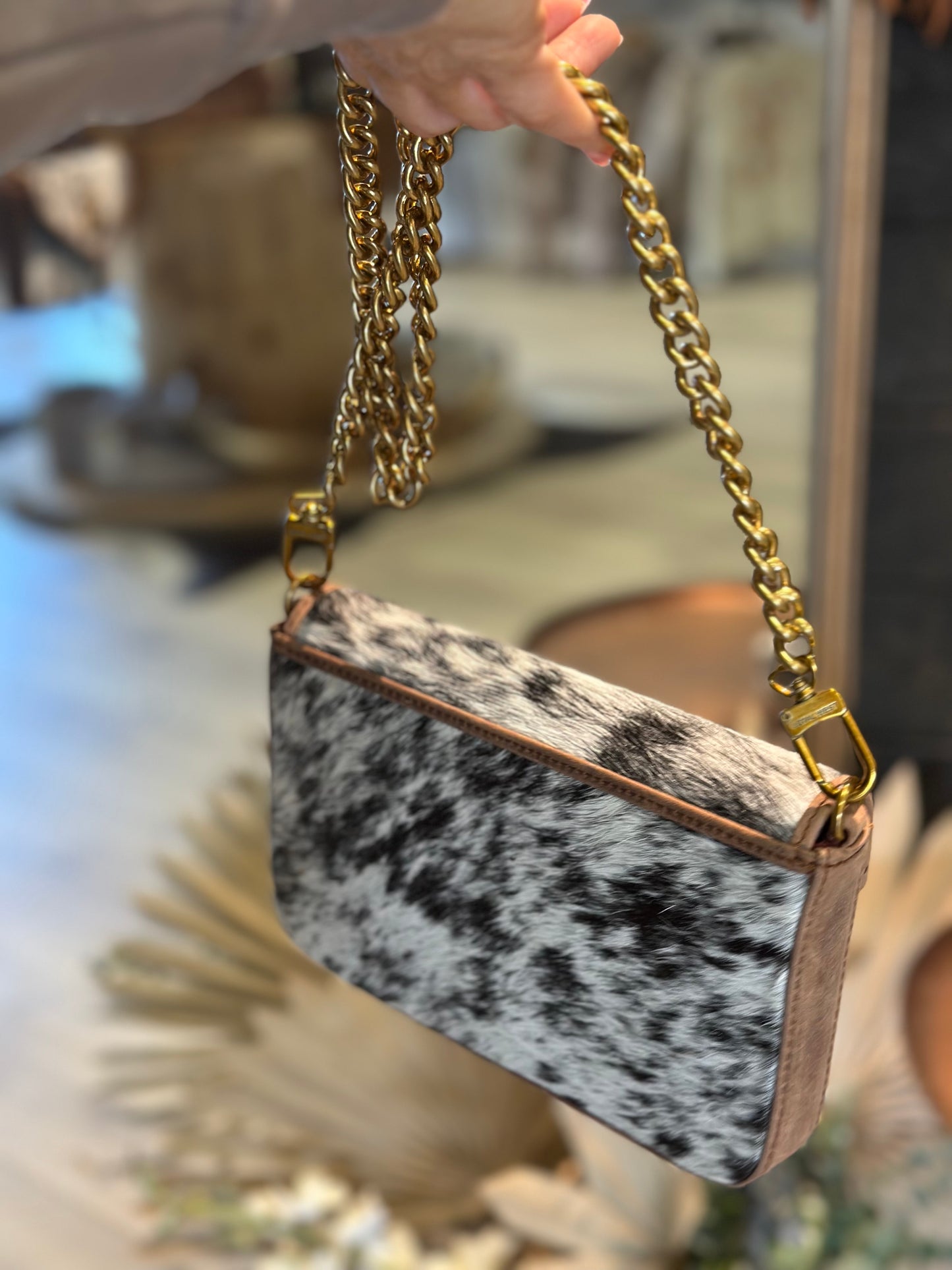 The LW speedster mini chain bag in brown and white cowhide